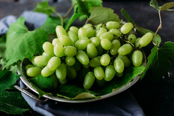 Ripe grapes on a dark background