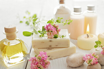 Fototapeta na wymiar SPA products with essential oils, herbs and and flowers