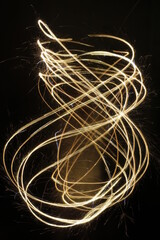 Sparklers in the night. Fourth of July, New Years festive ideas.
