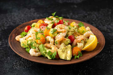 Prawn avocado salad with tomato cherry and herbs. Healthy food
