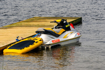 Emergency rescue jet ski moored to a wooden pier