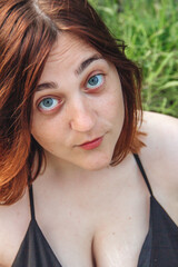 Redhead girl in greenery