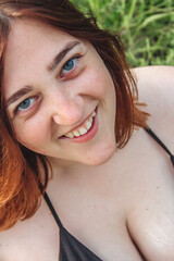 Redhead girl in greenery