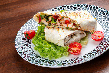 Fresh chicken roll with fresh tomatos, salad, cheese and onions. Shaurma, shawerma, fajita