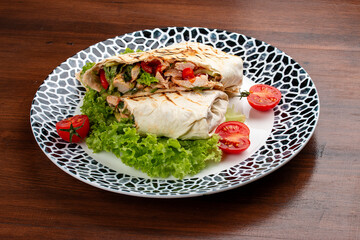 Fresh chicken roll with fresh tomatos, salad, cheese and onions. Shaurma, shawerma, fajita