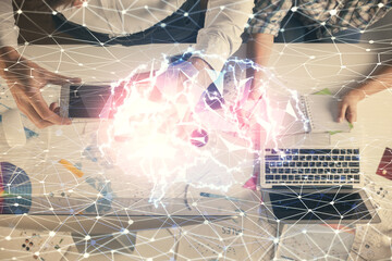 Double exposure of man and woman working together and human brain hologram drawing. Brainstorm concept. Computer background. Top View.
