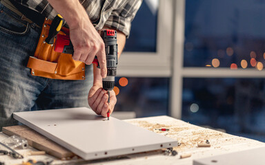 Man working during process of furniture manufacturing
