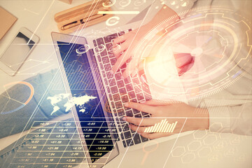 Double exposure of woman hands working on computer and data theme hologram drawing. Top View. Technology concept.