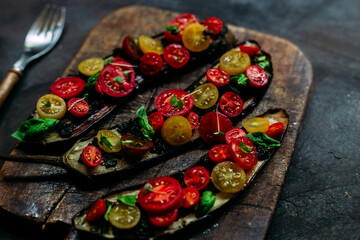 Baked eggplant appetizer with tomatoes and cheese