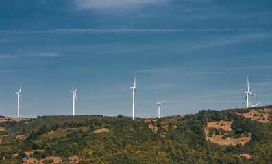 renewable green energy, windmills, wind energy, top of the hill