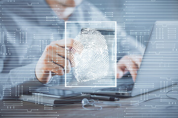 Double exposure of man hands holding a credit card and fingerprint drawing. Security in E-commerce...