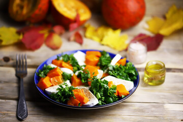 Pumpkin autumn salad a la caprese with mozzarella. Autumn food composition.