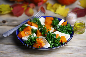 Pumpkin autumn salad a la caprese with mozzarella. Autumn food composition.