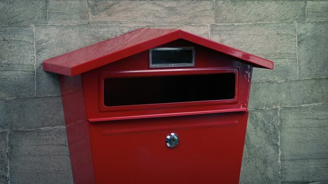 Posting Letter And Package Into Mail Box