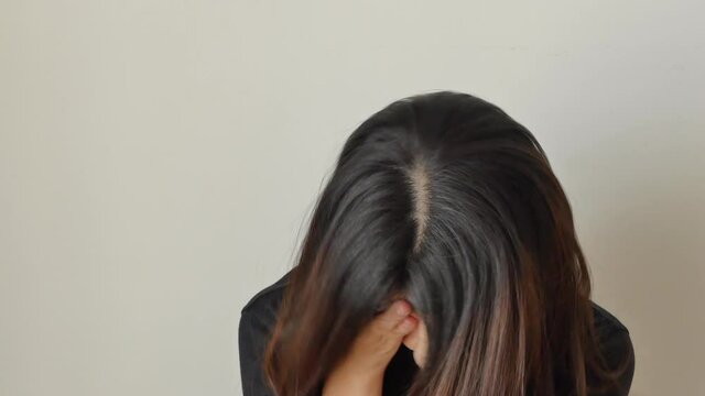 sad young woman doing facepalm