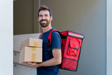 caucasian delivery man delivering parcel box. Courier service concept. horizontal view of happy...