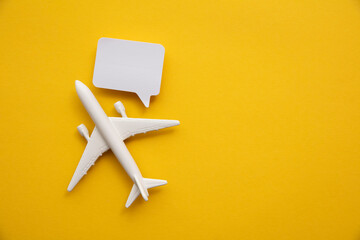 Airplane with a blank speech bubble. Flight feedback and holiday communication background