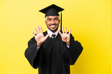 Young university graduate Colombian man isolated on yellow background counting nine with fingers