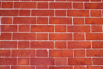 Brick wall background with copy space and paint splatter.  Horizontal photo with white lines, brown and red rugged surface for decoration, blank template, etc.