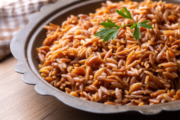 Traditional delicious Turkish dish, barley noodle pilaf (Turkish name; Arpa sehriye pilavi)