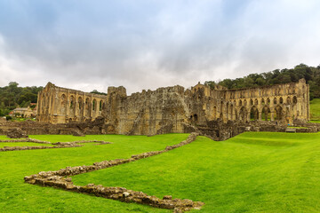 Fototapeta na wymiar Ruins of Rievaulx Abbey, a Cistercian abbey in Rievaulx near Helmsley in the North York Moors National Park, England.