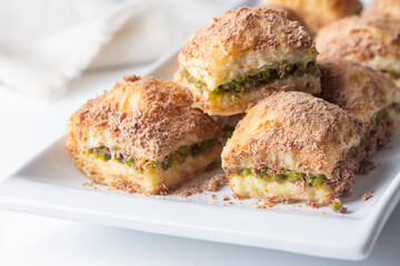 Traditional turkish new dessert cold milky baklava with pistachio (Turkish name; soguk baklava)