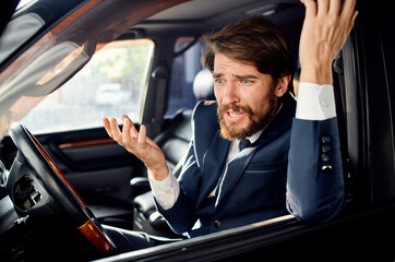 bearded man Driving a car trip luxury lifestyle success