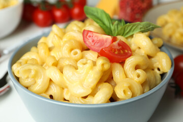 Concept of tasty eating with macaroni with cheese on white background