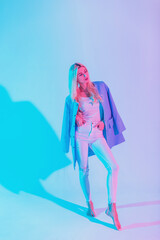 Fashionable beautiful elegant business woman in a stylish blue blazer with a white blouse and jeans...