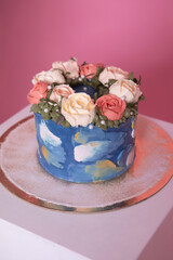 Birthday cake decorated with cream flowers