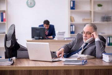Two male employees working in the office