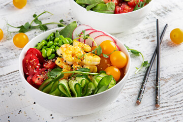 White bowl with poke and chopsticks