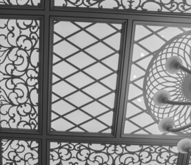 carved ceiling with lighting in light colors