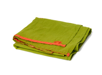 folded green linen towel on white background, top view