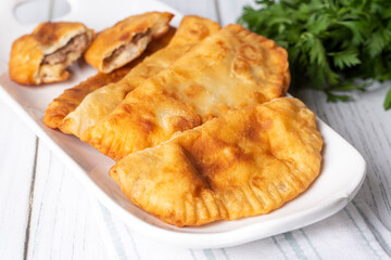 Traditional delicious Turkish foods,minced meat in savoury pastry (Turkish name; ci borek or cig borek)