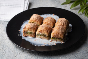 Traditional turkish new dessert cold milky baklava with pistachio (Turkish name; soguk baklava)