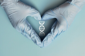The doctor holds a DNA chain in his hand. A symbol of research and prevention of genetic diseases
