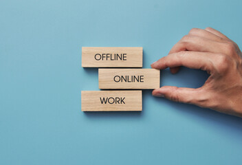Wooden cubes with the inscription: online work. The symbol for choosing remote, online work