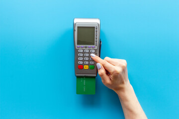 Hand paying by card with pos payment terminal. Payment transactions concept