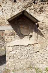 Pompeii (Italy). Architectural detail on the exterior wall of a house in the city of Pompeii
