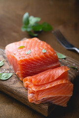 A piece of smoked salmon, cut into thin slices