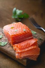 A piece of smoked salmon, cut into thin slices