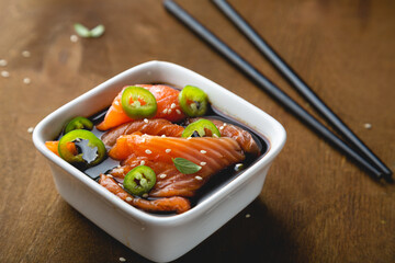 Pickled pieces of salmon on the table