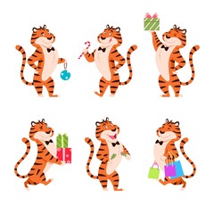 Fototapeta na wymiar Cartoon tigers set. Holiday standing characters for New Year 2022. Adorable flat Chinese symbol. Smiling orange striped wildcat with present, Christmas cracker, candy. Xmas animal vector illustration.