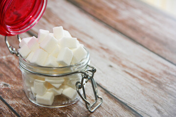 sweet white sugar cubes in a jar