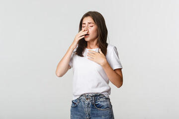 Young woman with allergy sneezing. Girl feeling sick having runny nose - obrazy, fototapety, plakaty