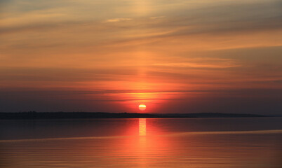 Fototapeta na wymiar sunset over lake water surface