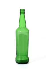 green glass bottle of whisky standing on white background