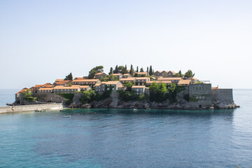 View on the Sveti Stefan island. Details of architecture in the old town. Hotel of millionaires in the Mediterranean.