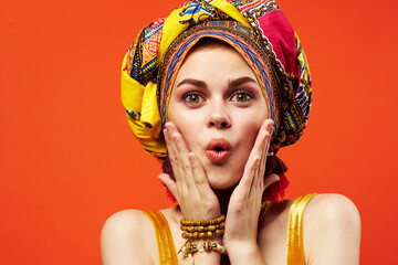 Fototapeta premium cheerful woman ethnicity multicolored headscarf makeup glamor isolated background